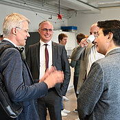 Diskussions between Prof. Dr. Trauzettel, Prof. Dr. Sven Höfling, Prof. Dr. Yong-Hoon Cho and Dr. Jeongwon Lee during the coffee break.